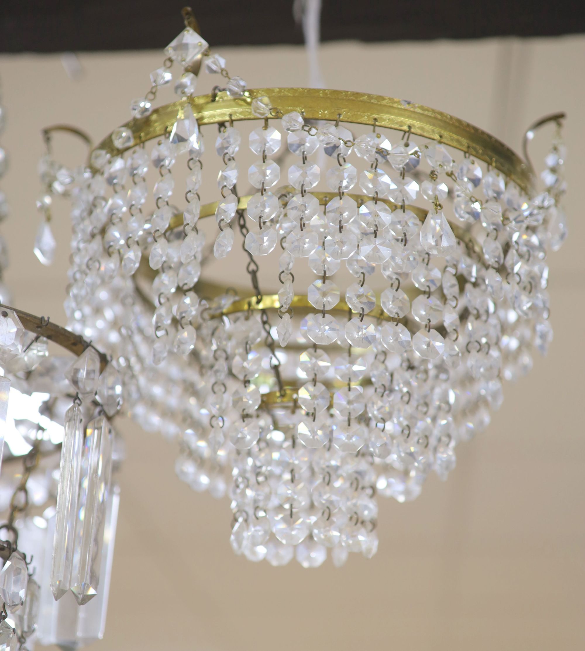 A glass lustre chandelier and another